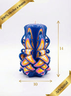 Vela decorativa artesanal azul y dorada con medidas de 14 cm de alto y 10 cm de ancho