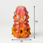 Vela decorativa floral artesanal con medidas de 14 cm de alto y 10 cm de ancho